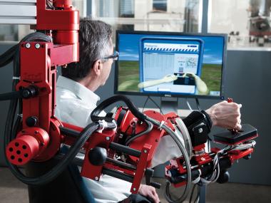 Therapy robot ARMin and patient, © ETH Zurich / Roland Tännler