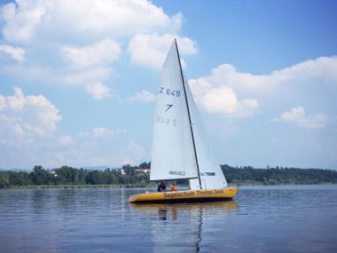 Sail boat of the sailing school Thomas Zwick on the lake